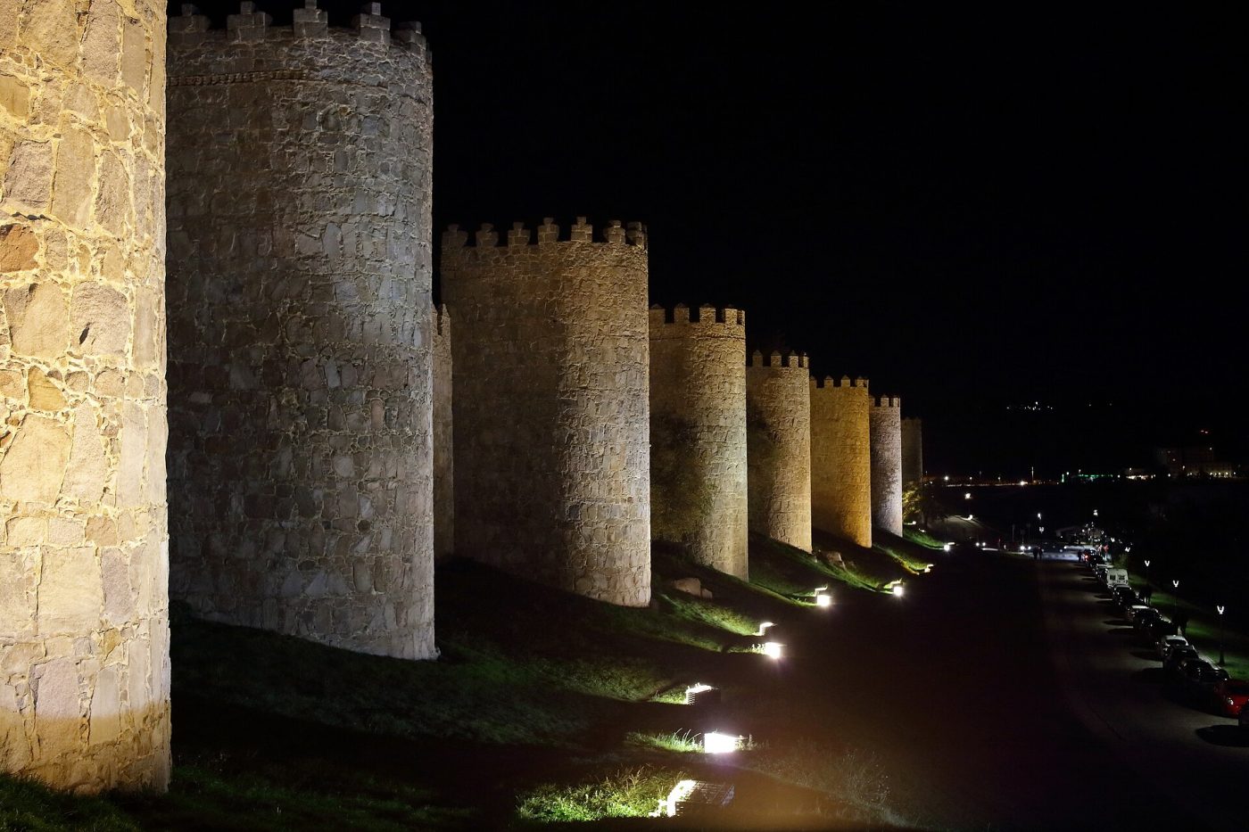 Towers of the Ávila walls lit up at night